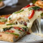 Slice of Irresistible Cheesy Baked Pizza Pie