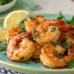 Air Fryer Lemon Pepper Shrimp served with parsley and lemon.